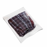 Shorts packed in a white flat pouch with zip lock