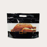 Roast chicken packed in a black chicken bag window