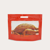 Roast chicken packed in a red chicken bag box window