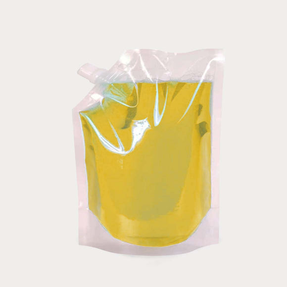 Liquid pouch spout transparent with juice