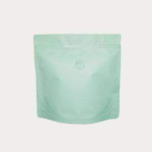 Pastel green matte square shape coffee bag front view