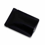 An open matte black flat pouch